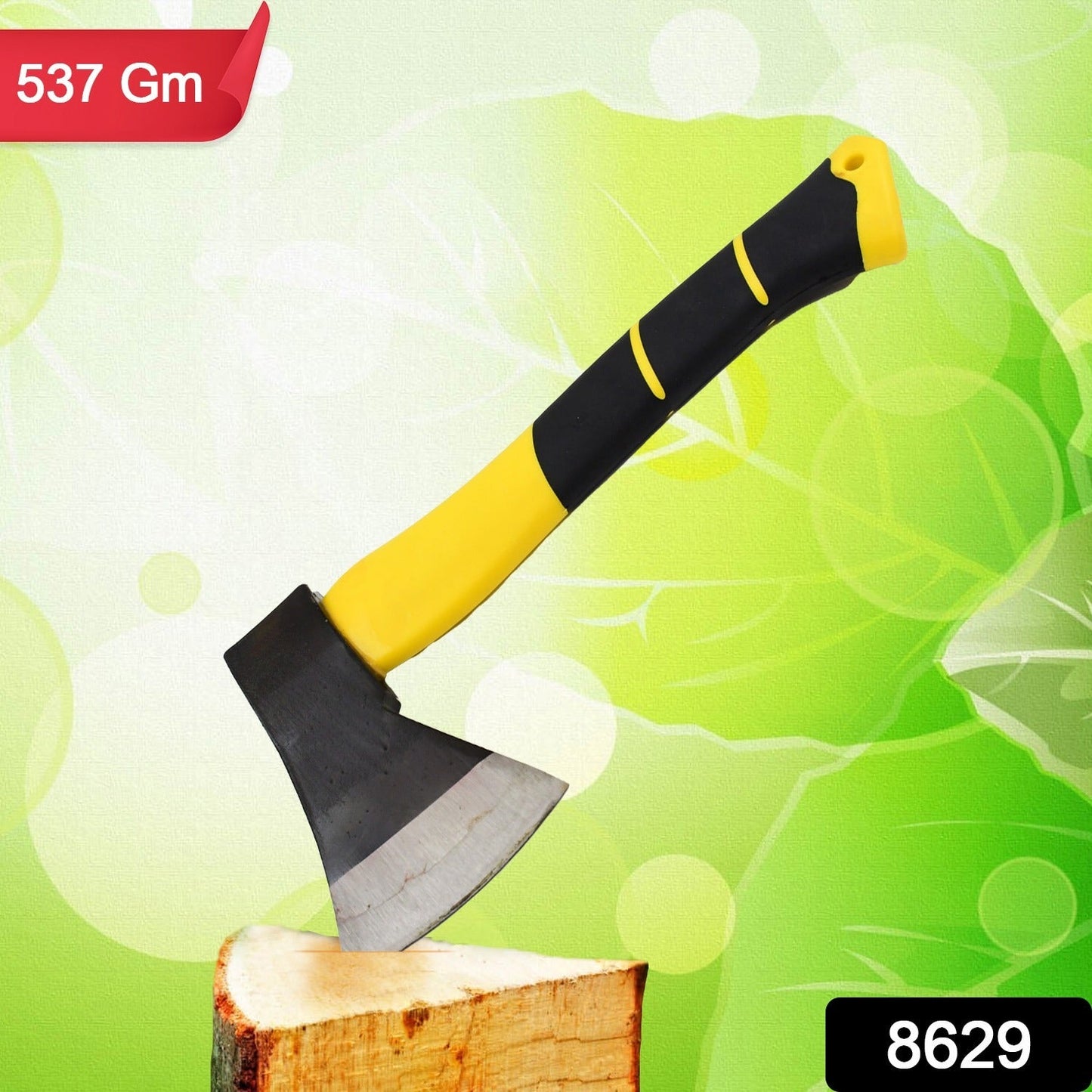 A yellow and black hatchet axe stands upright on a piece of wood against a green blurred background.