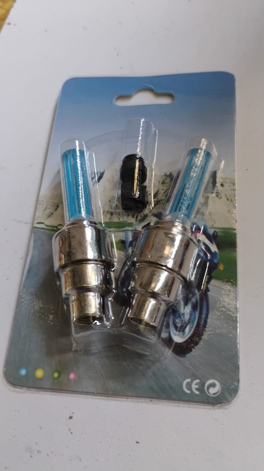 Step-by-step diagram illustrating the easy installation process for Motion-activated LED wheel valve cap lights.