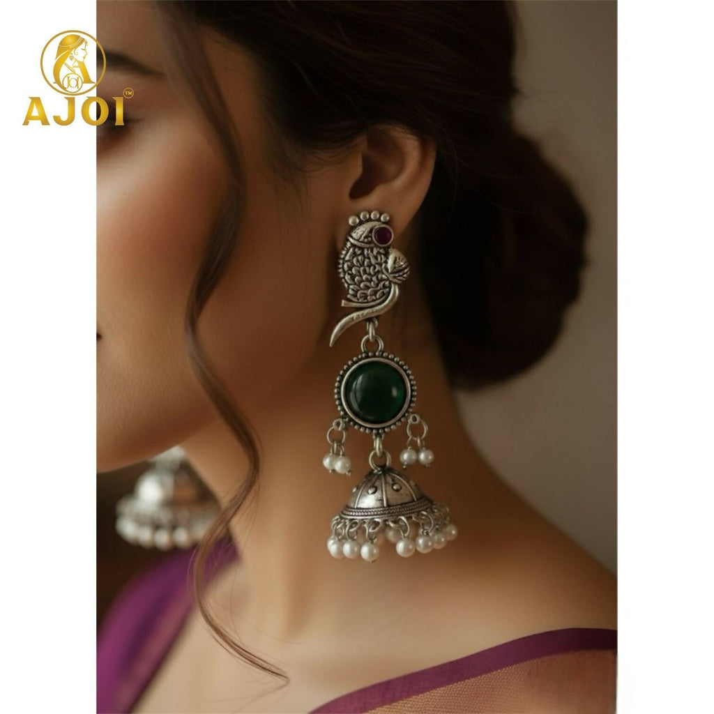 Handcrafted Antique Silver Peacock Jhumka Earrings with Emerald Green Stone & Pearl Drop Detailing