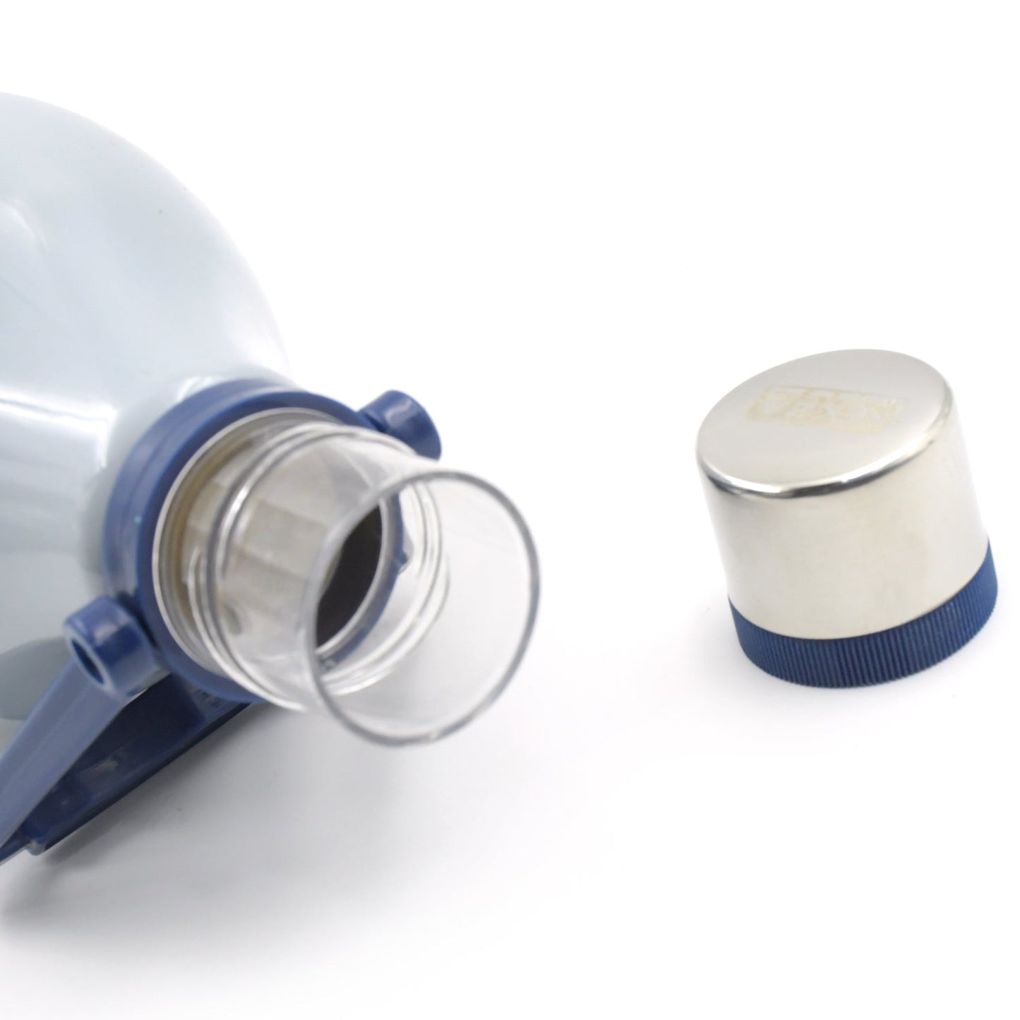 Close-up of the water bottle's open mouth with a clear plastic insert, and the silver cap next to it.