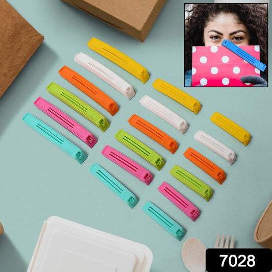 A collection of colorful reusable plastic clips sealing various food bags.