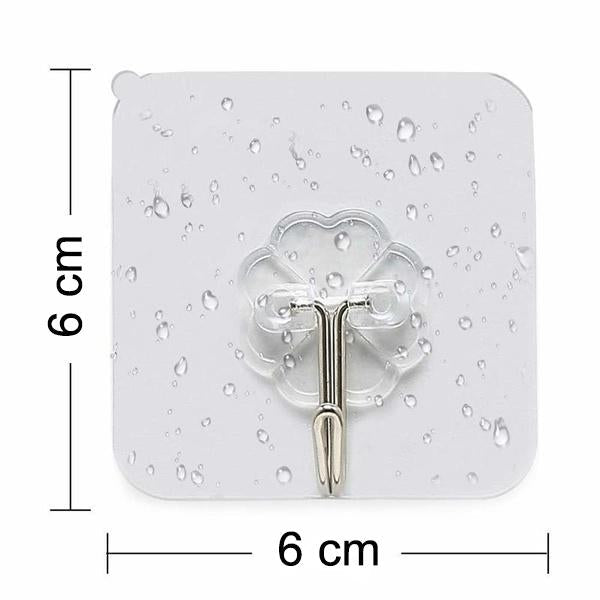 A clear adhesive hook with a silver stainless steel hook is shown with dimensions, indicating it is 6 cm by 6 cm.