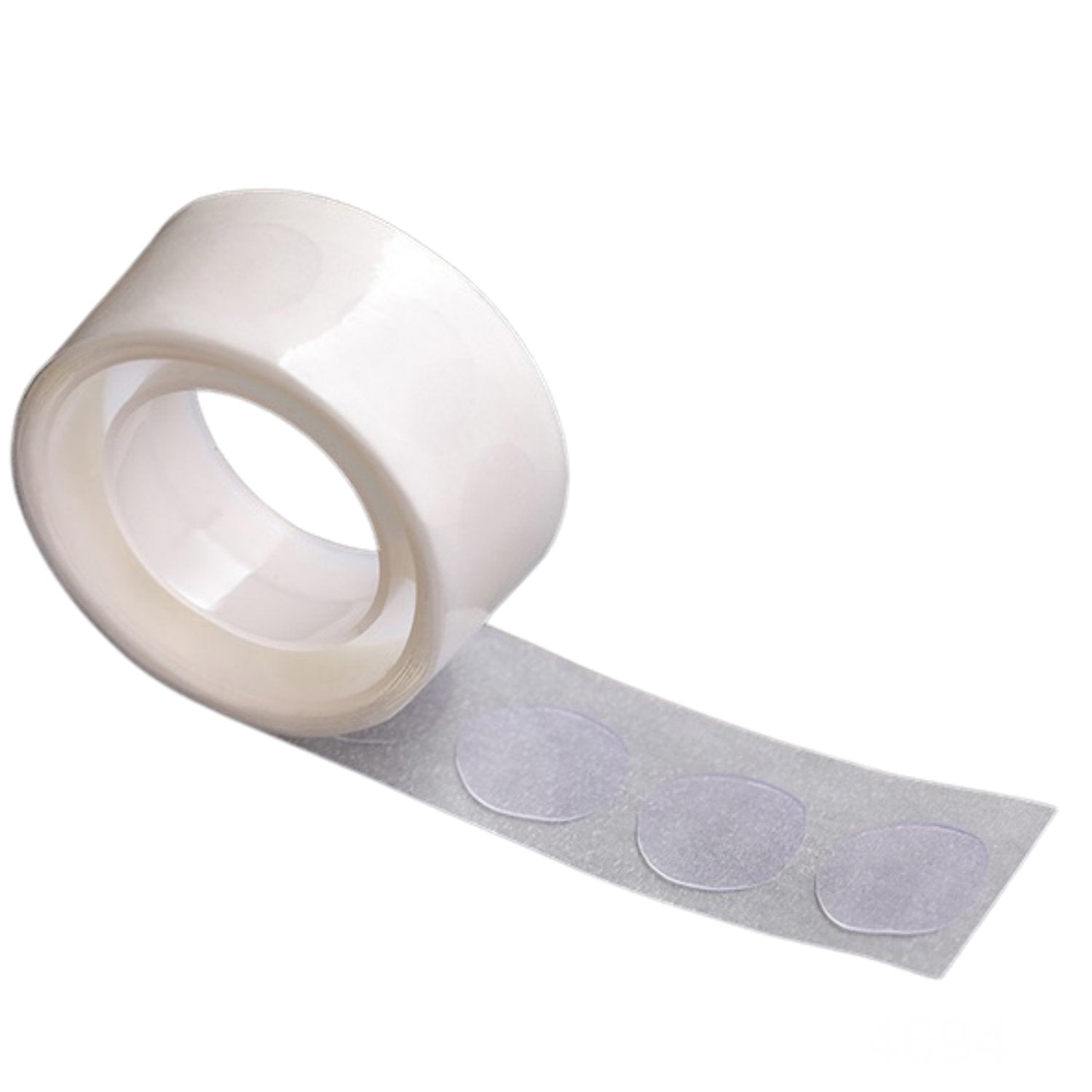 A single roll of clear, round glue dots on a white backing, angled against a plain white background.