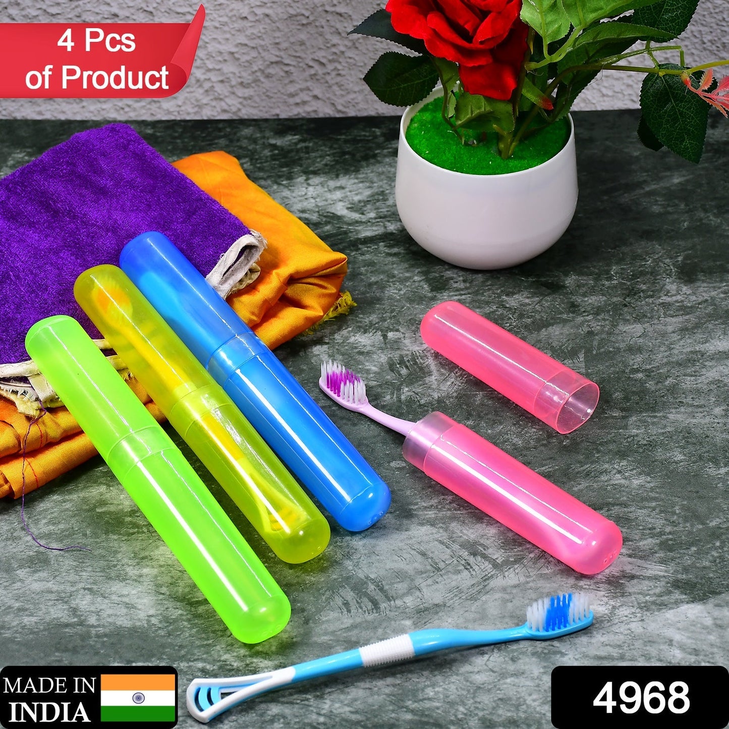 Four colorful toothbrush cases in pink, yellow, blue, and green, along with two toothbrushes, on a dark surface with a red