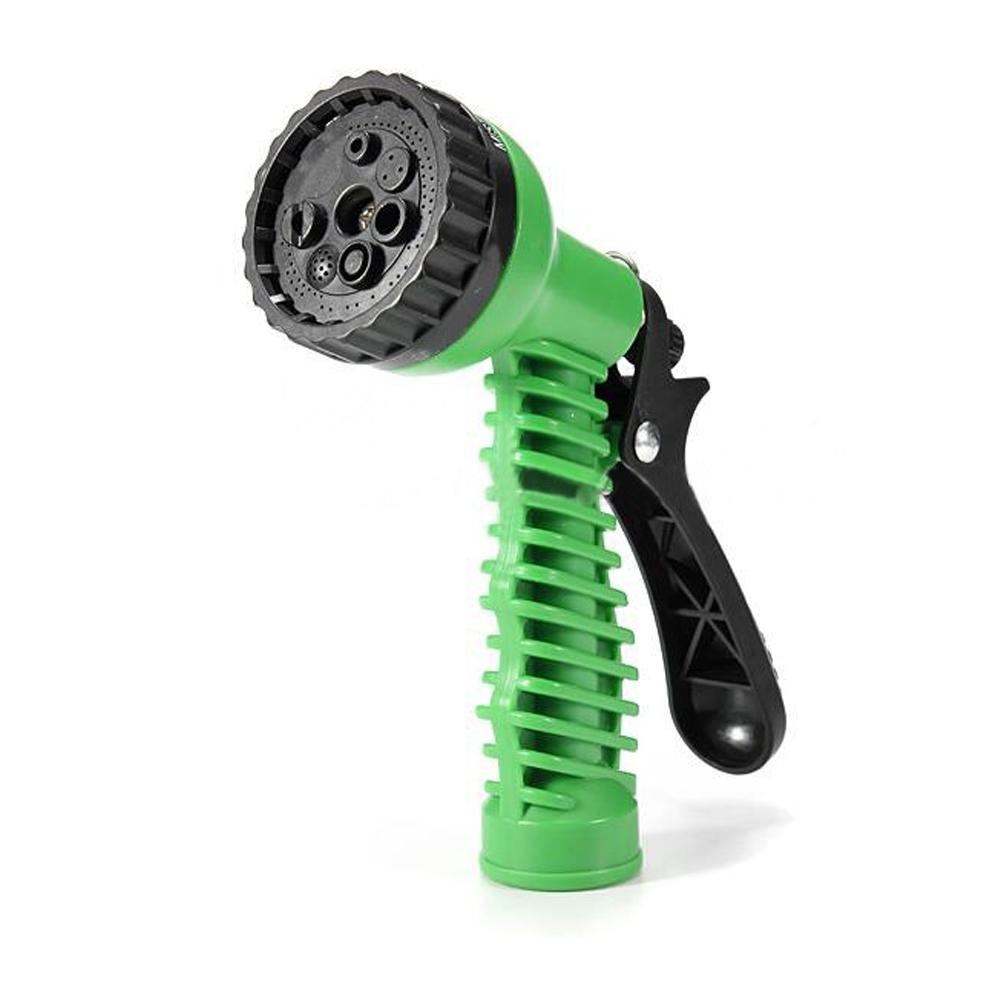 A green and black hose nozzle with a textured grip and multi-pattern spray head on a white background.