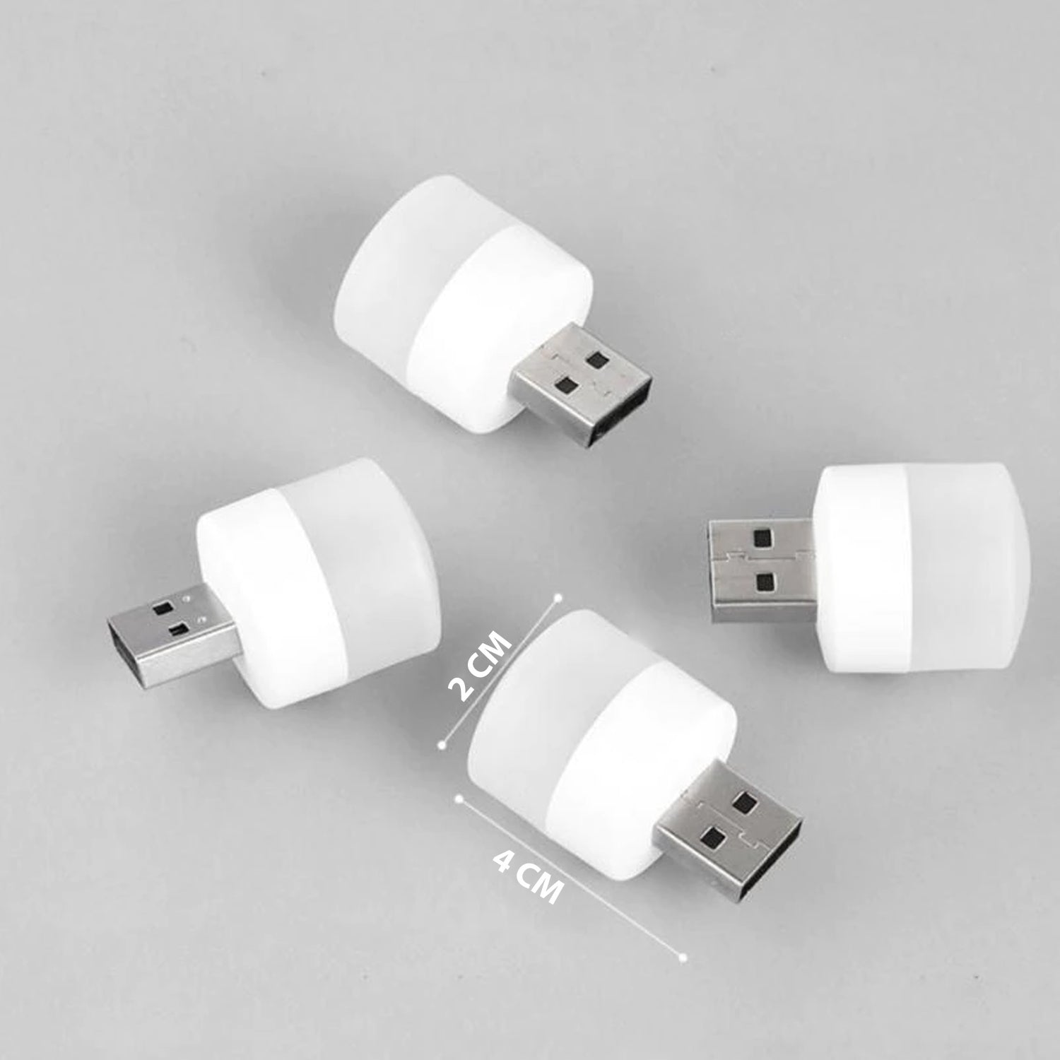 Four white USB LED night lights are arranged on a grey surface, with dimensions of 2 cm and 4 cm indicated.