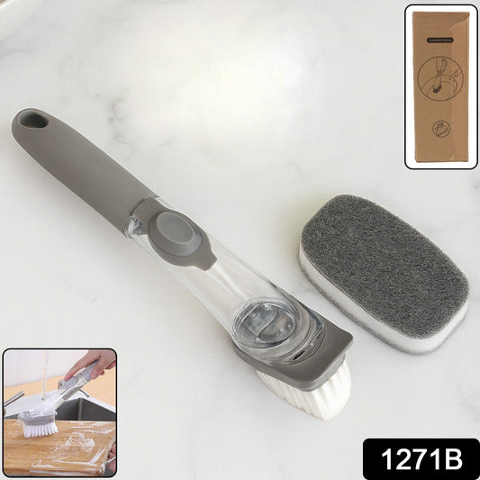 Close-up of the soap-dispensing dish brush featuring the interchangeable scrub sponge head