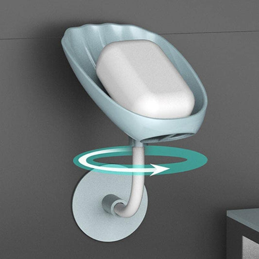 Grey self-draining soap dish with a bar of soap, showcasing its sleek design.