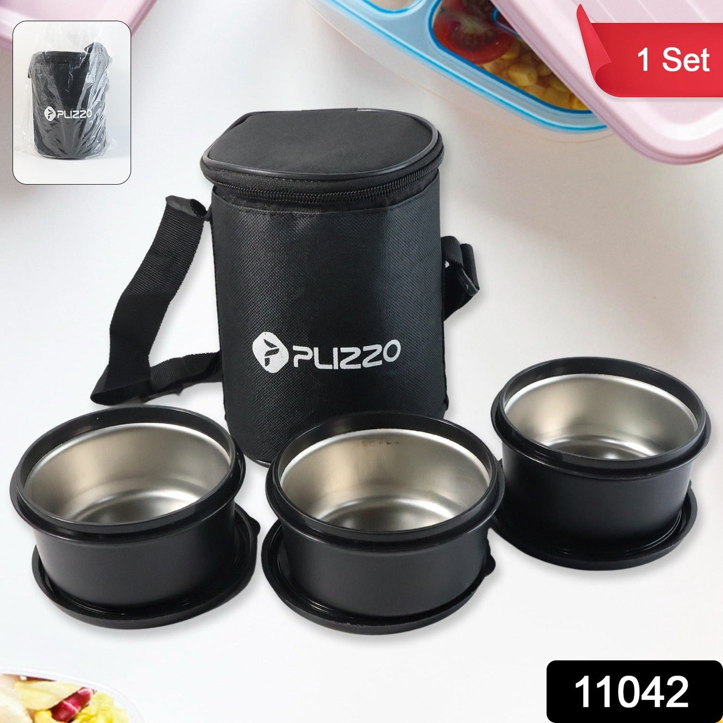 Stainless steel lunch box containers placed neatly inside insulated carry bag