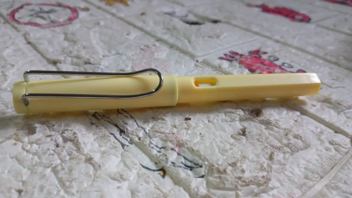 Close-up of an everlasting magic pencil highlighting its portable and durable design with a replaceable eraser.