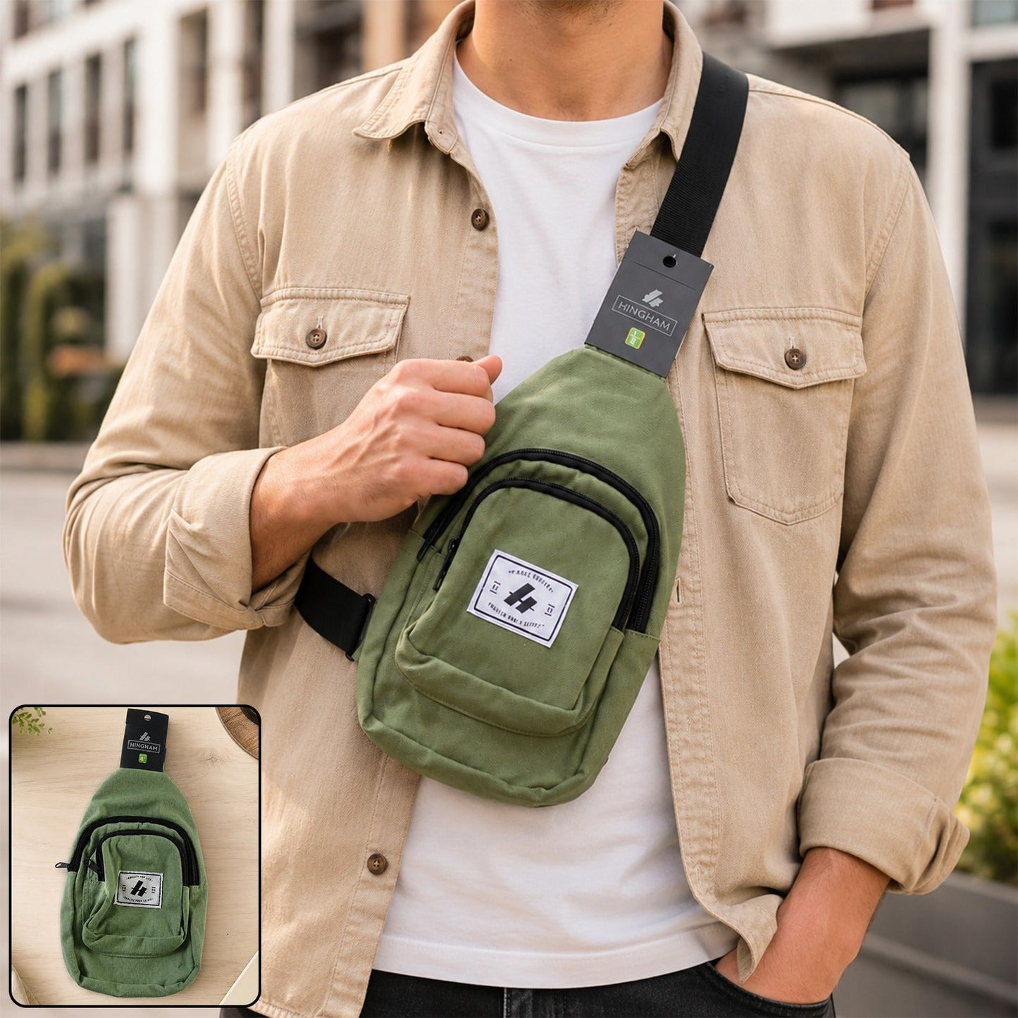 A man wearing a light brown shirt and a green canvas sling bag with a black strap over his chest, outdoors.