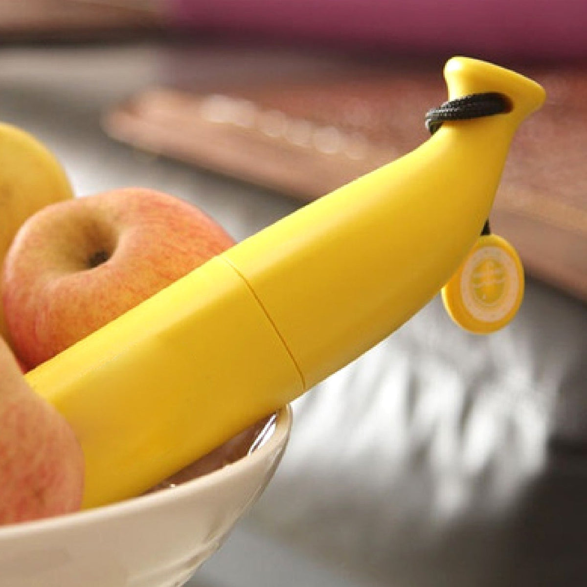A compact and stylish foldable banana shaped umbrella is shown open.