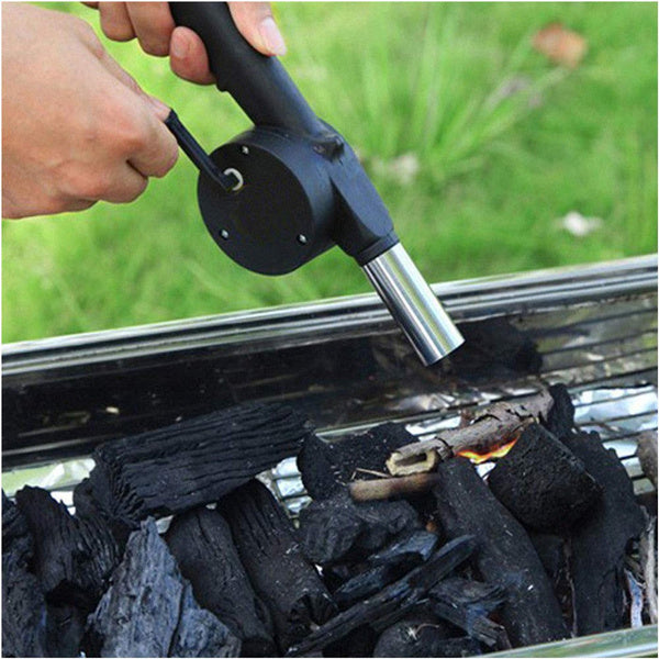 Ergonomic hand crank air blower for charcoal grills, showing side profile.