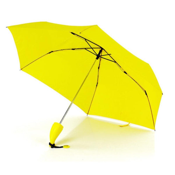 A yellow umbrella with a curved banana-like handle is open and standing on a white surface.