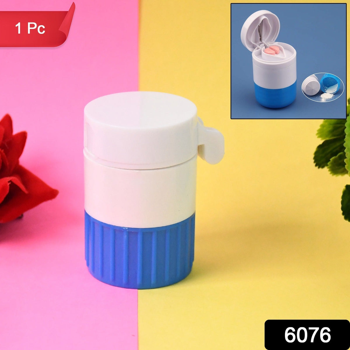 White and blue pill crusher and cutter on a pink and yellow background with a red flower.