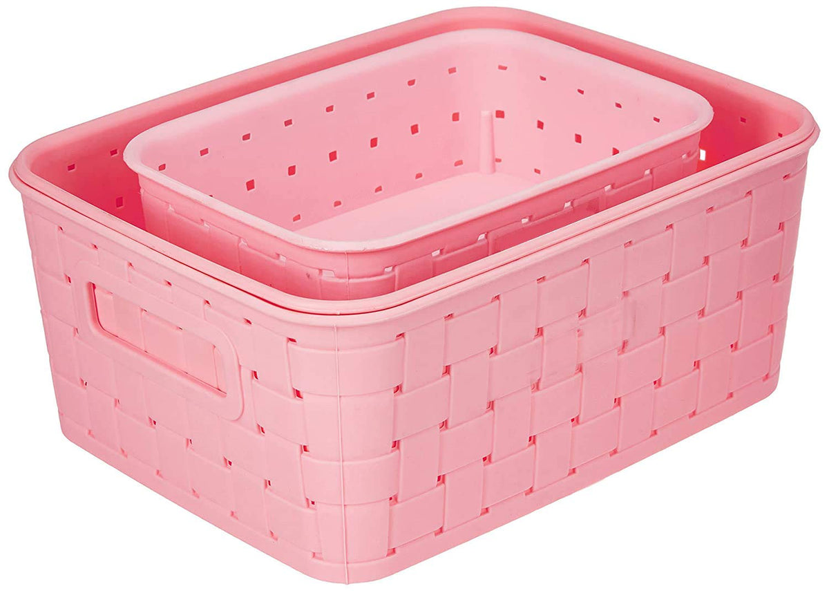 Two pink plastic storage baskets, one nested inside the other, with a woven texture.