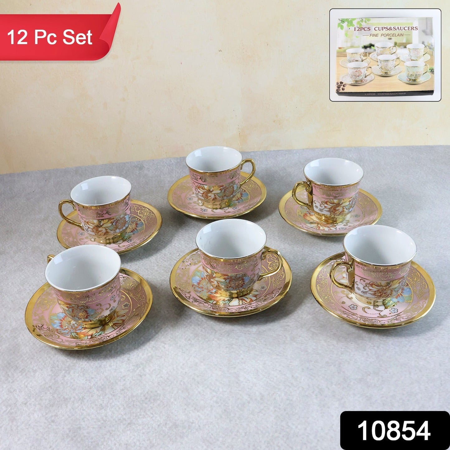 Six pink and gold floral porcelain teacups and saucers on a gray surface, with a small inset showing more sets.