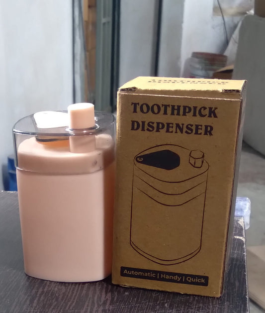 Automatic toothpick dispenser in a minimalist setting, ready for use.
