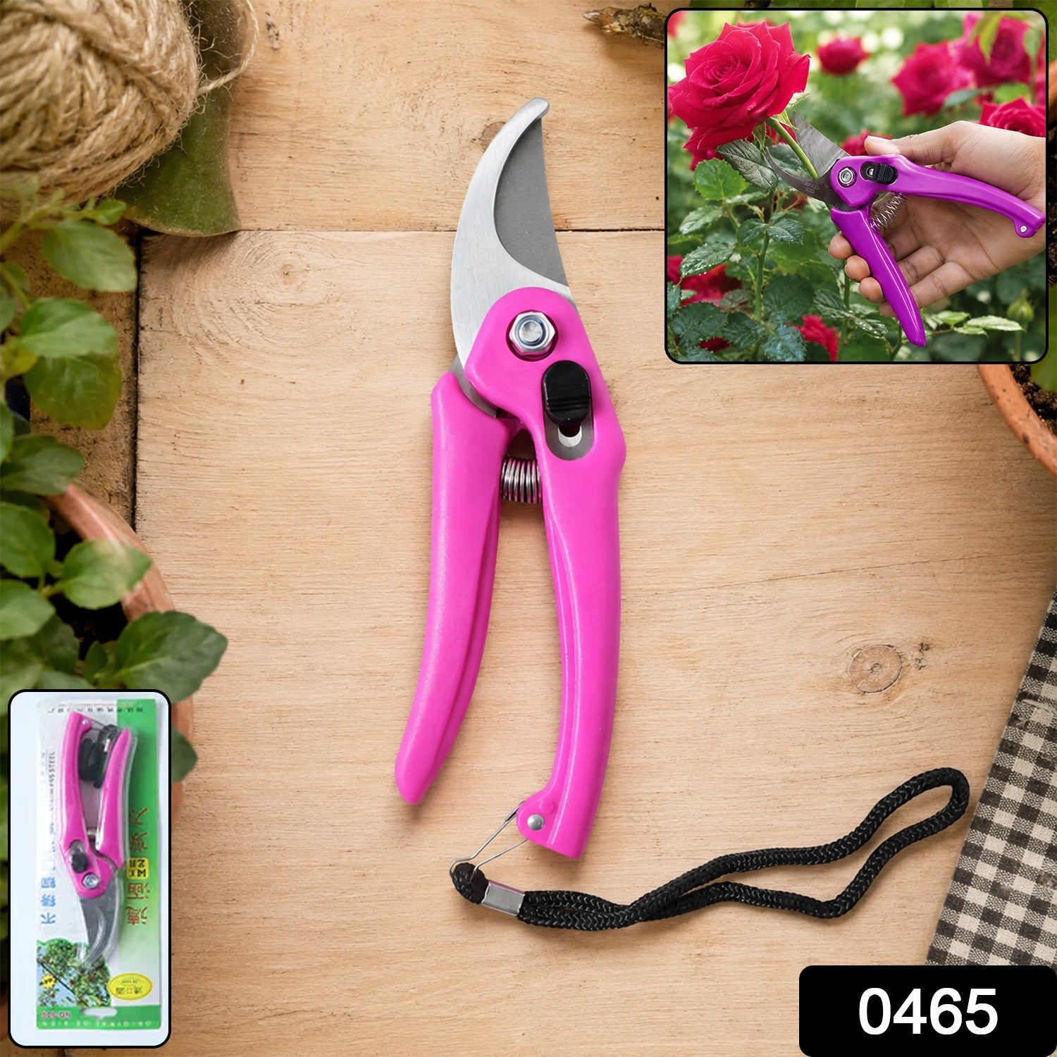 A pink garden pruner with a black wrist strap on a wooden surface, with its retail packaging in the bottom left.