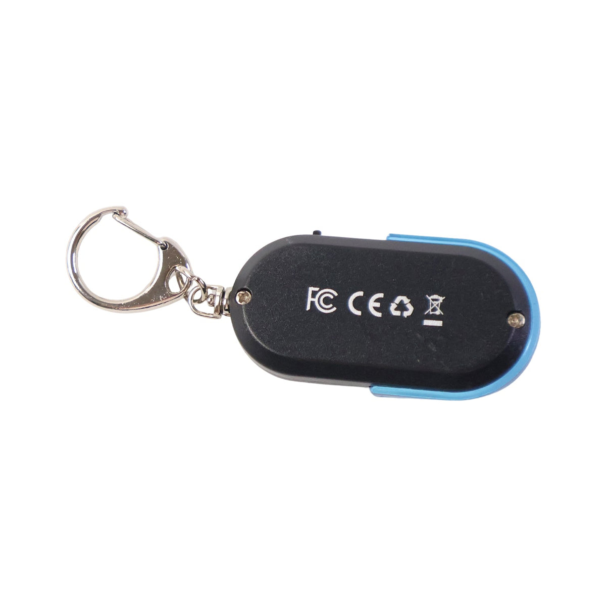 A black and blue personal safety alarm keychain with a silver carabiner clip hangs from a key in a wooden door.
