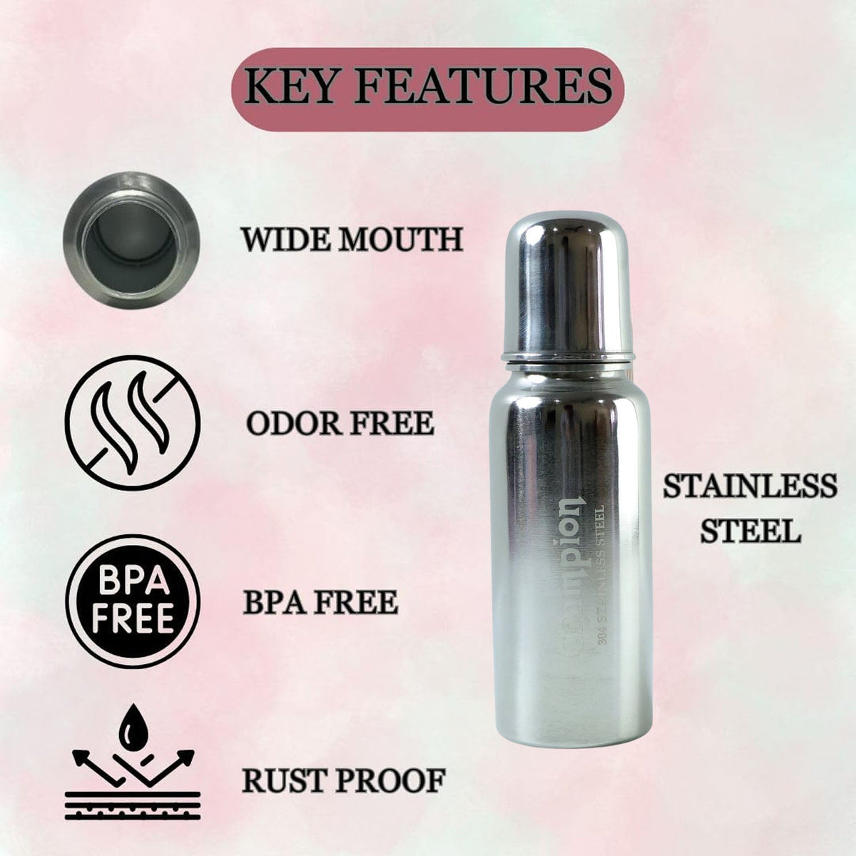 A stainless steel feeding bottle with a clear nipple and its metal cap rests on a light brown surface in front of white