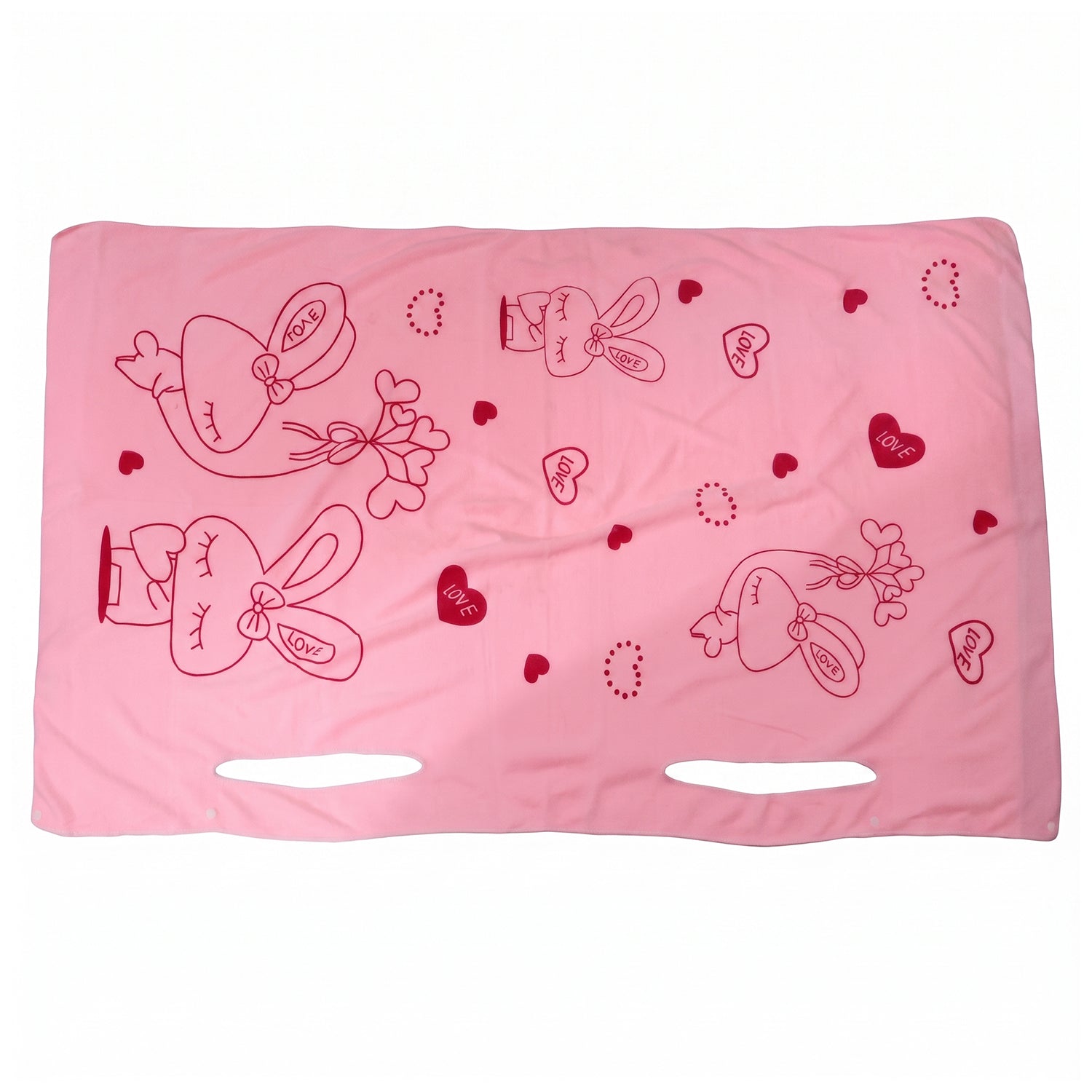 A pink towel with red bunny and heart prints and armholes is spread flat against a white background.