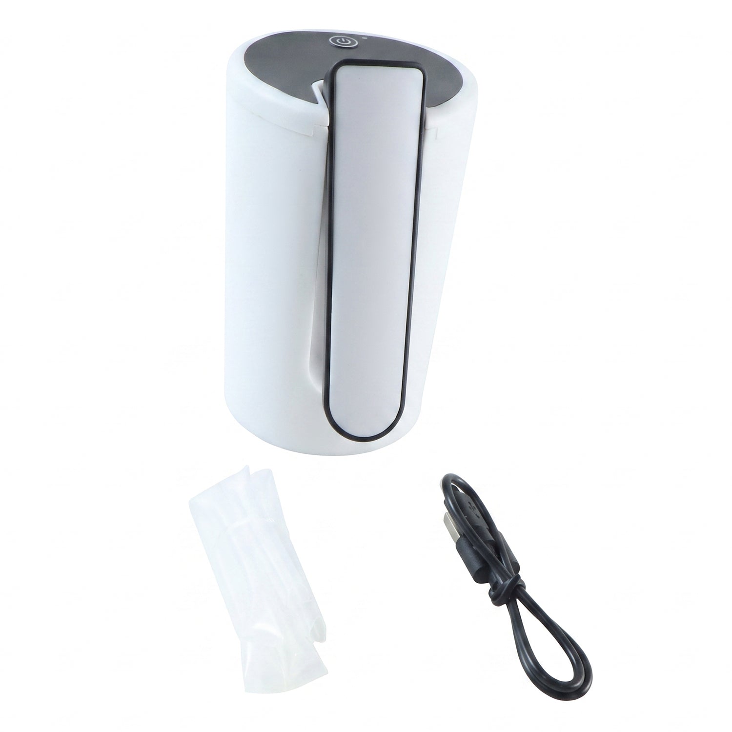 The white and black electric water dispenser pump, a clear silicone tube, and a black USB charging cable are laid out on a