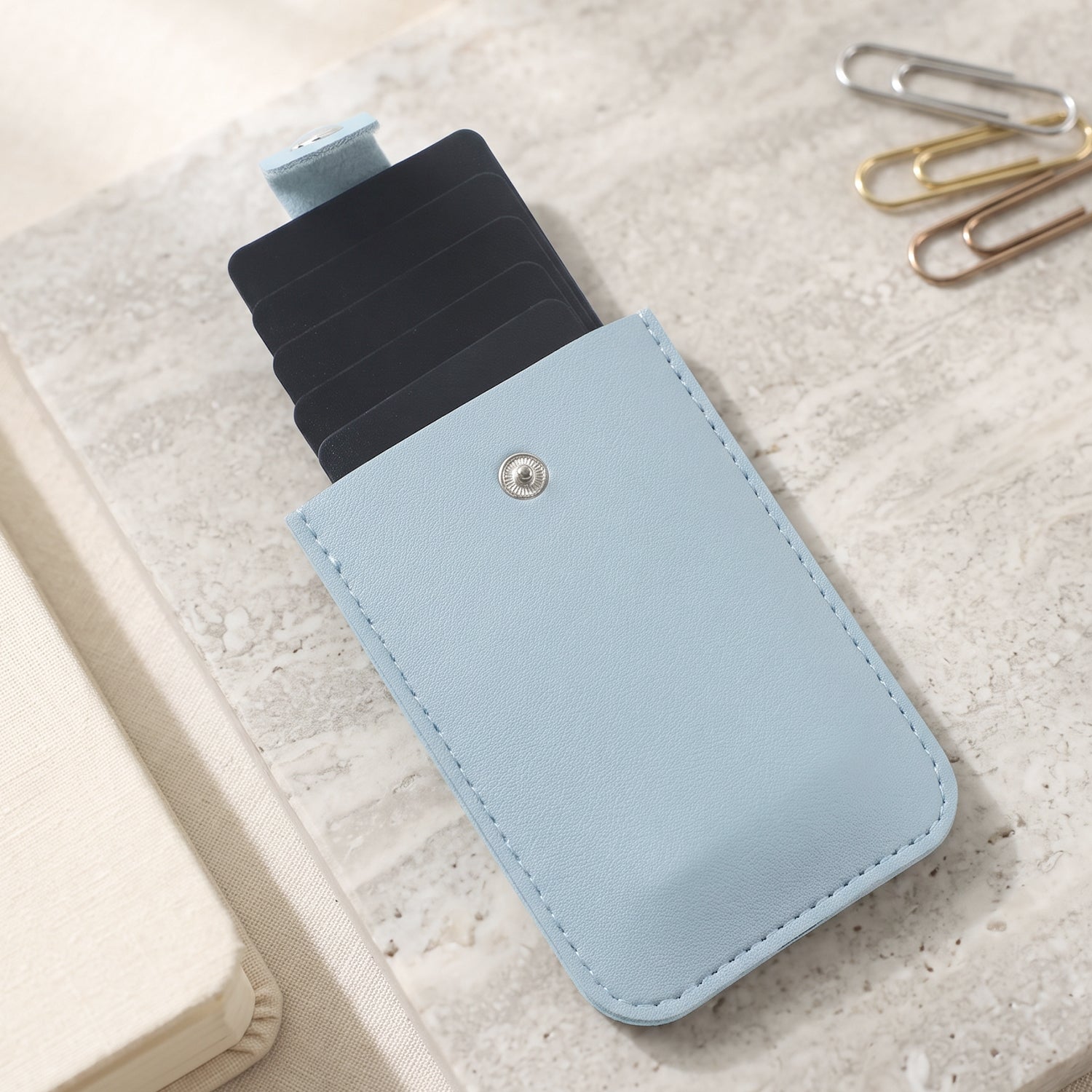 Slim card wallet held in hand