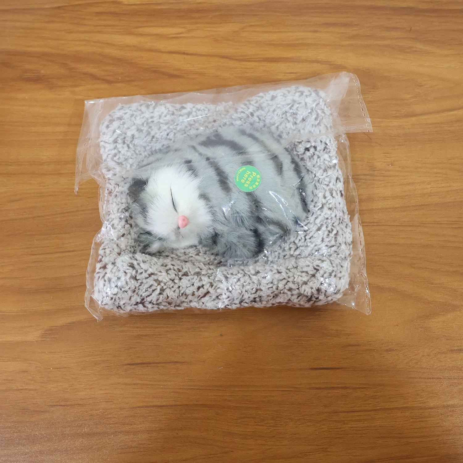 Tiny plush car toy adding a cozy touch to car dashboard