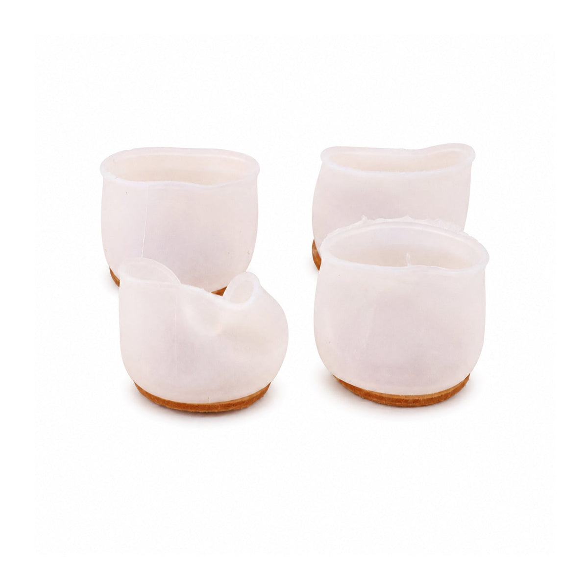Four translucent silicone furniture leg protectors with felt bottoms on a white background.