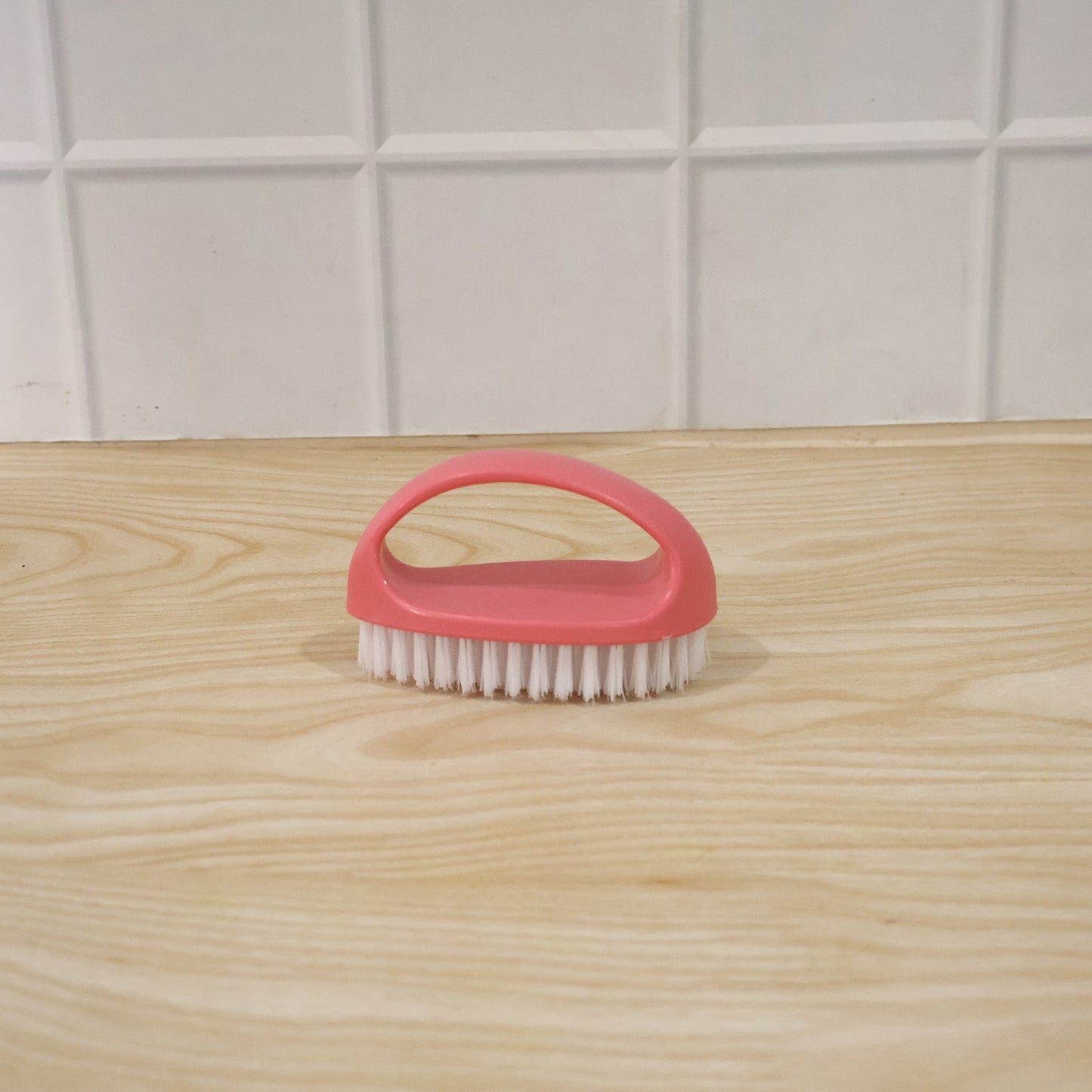 Person using multi-purpose cleaning brush on surface for deep cleaning