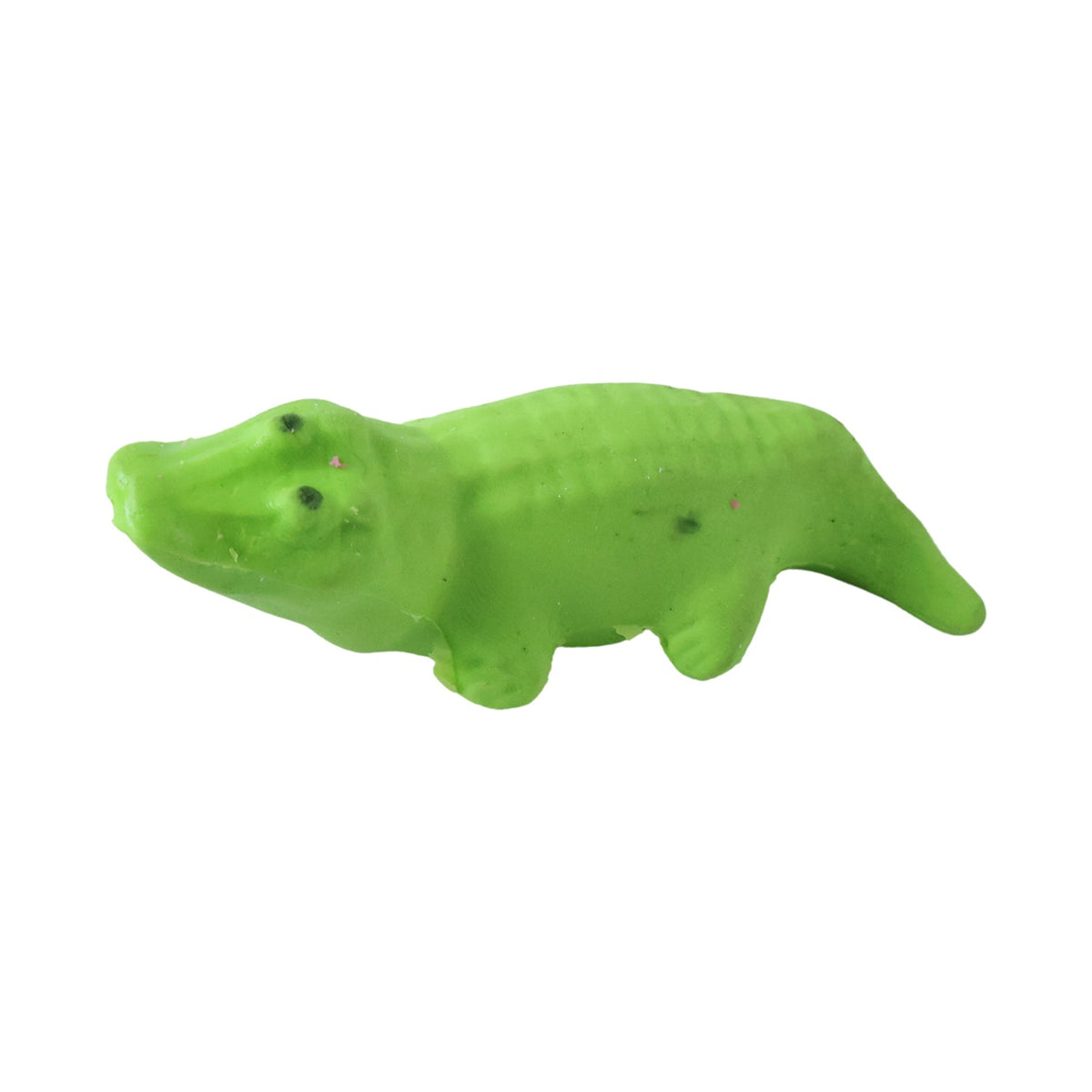 A single green crocodile-shaped eraser is shown against a plain white background.