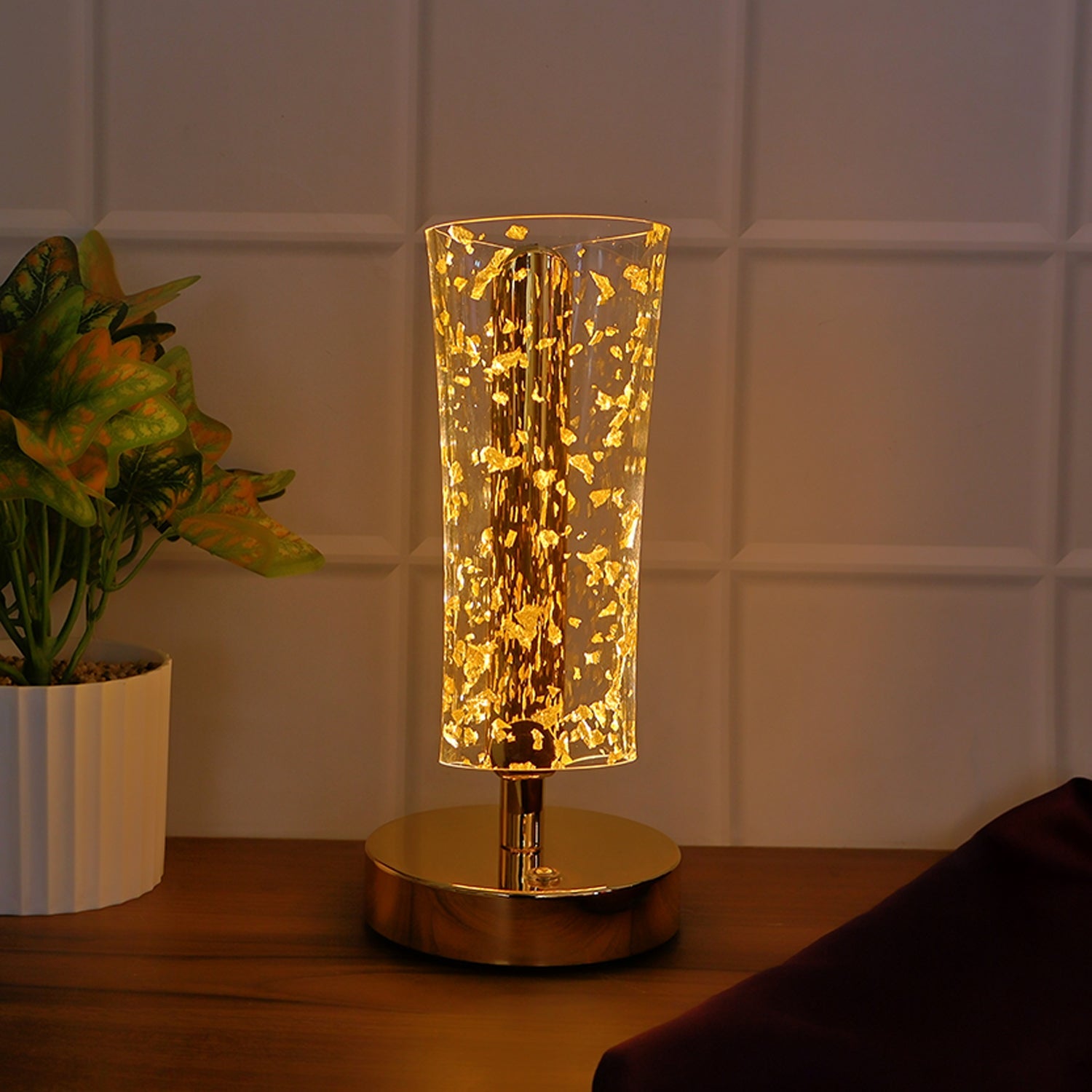 Stylish LED table lamp with golden flakes in acrylic shade for living room