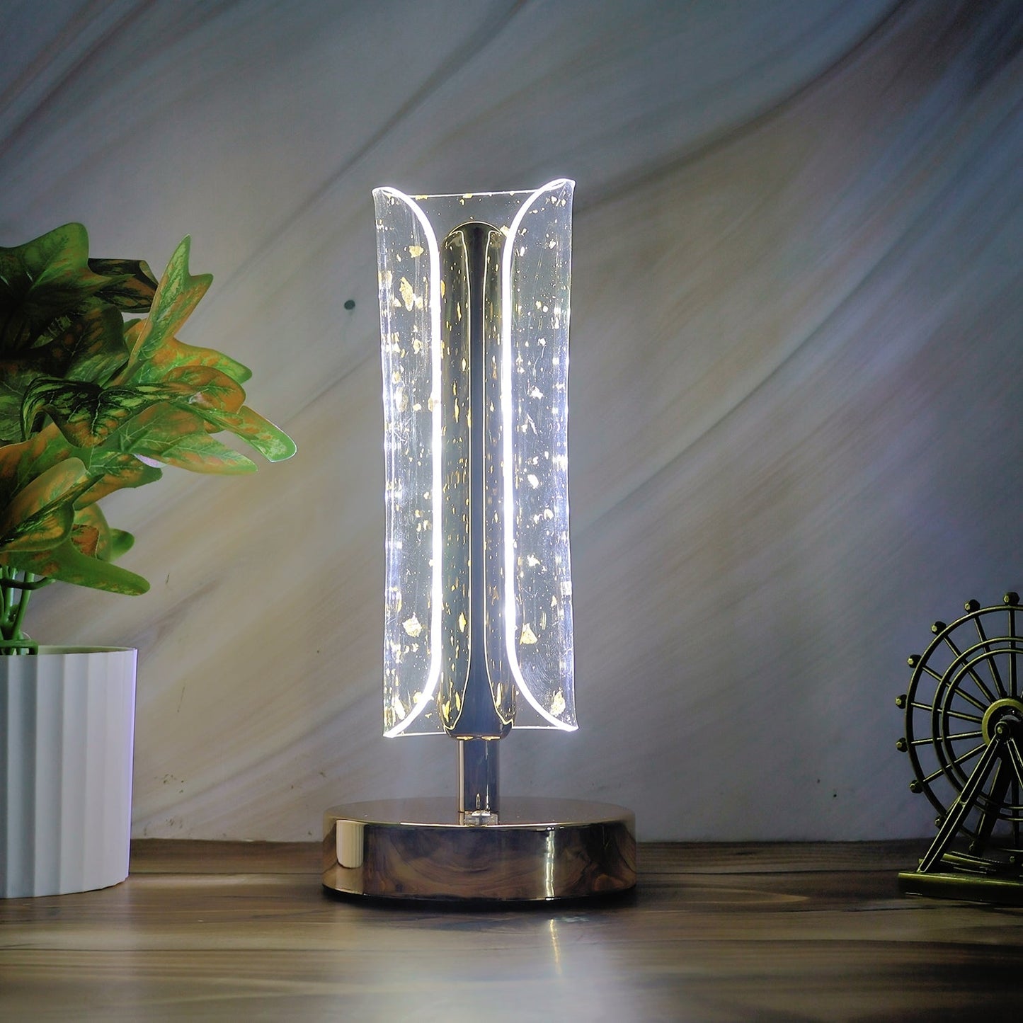 Crystal table lamp showcasing warm light and elegant golden base design