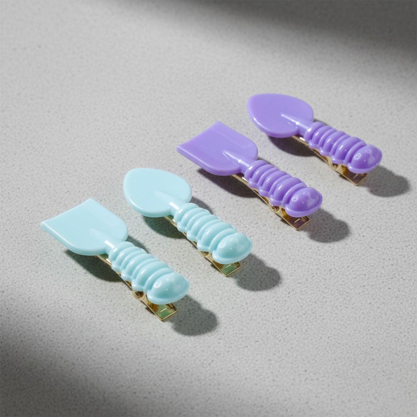 Lifestyle image showing girls wearing spoon shaped hair clips