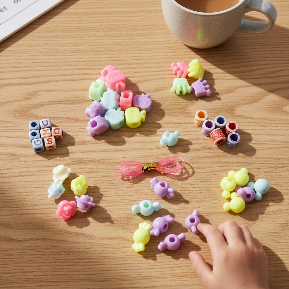 Close-up of colorful beads and charms in kids jewelry making kit