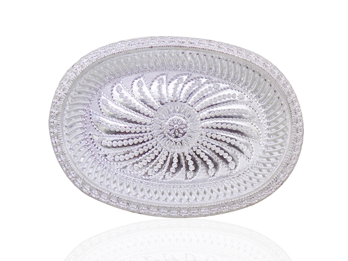 A silver oval decorative serving tray with an intricate floral pattern, viewed from directly above.