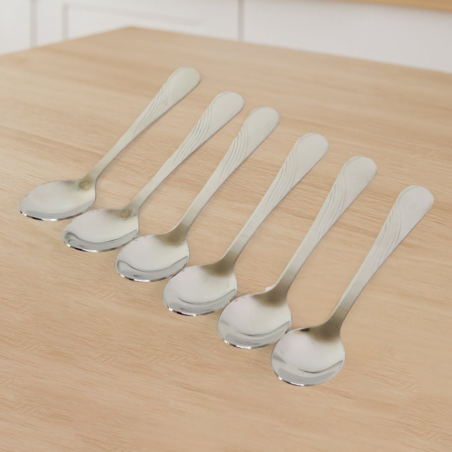 Close-up view of stainless steel dining spoons highlighting their sleek design