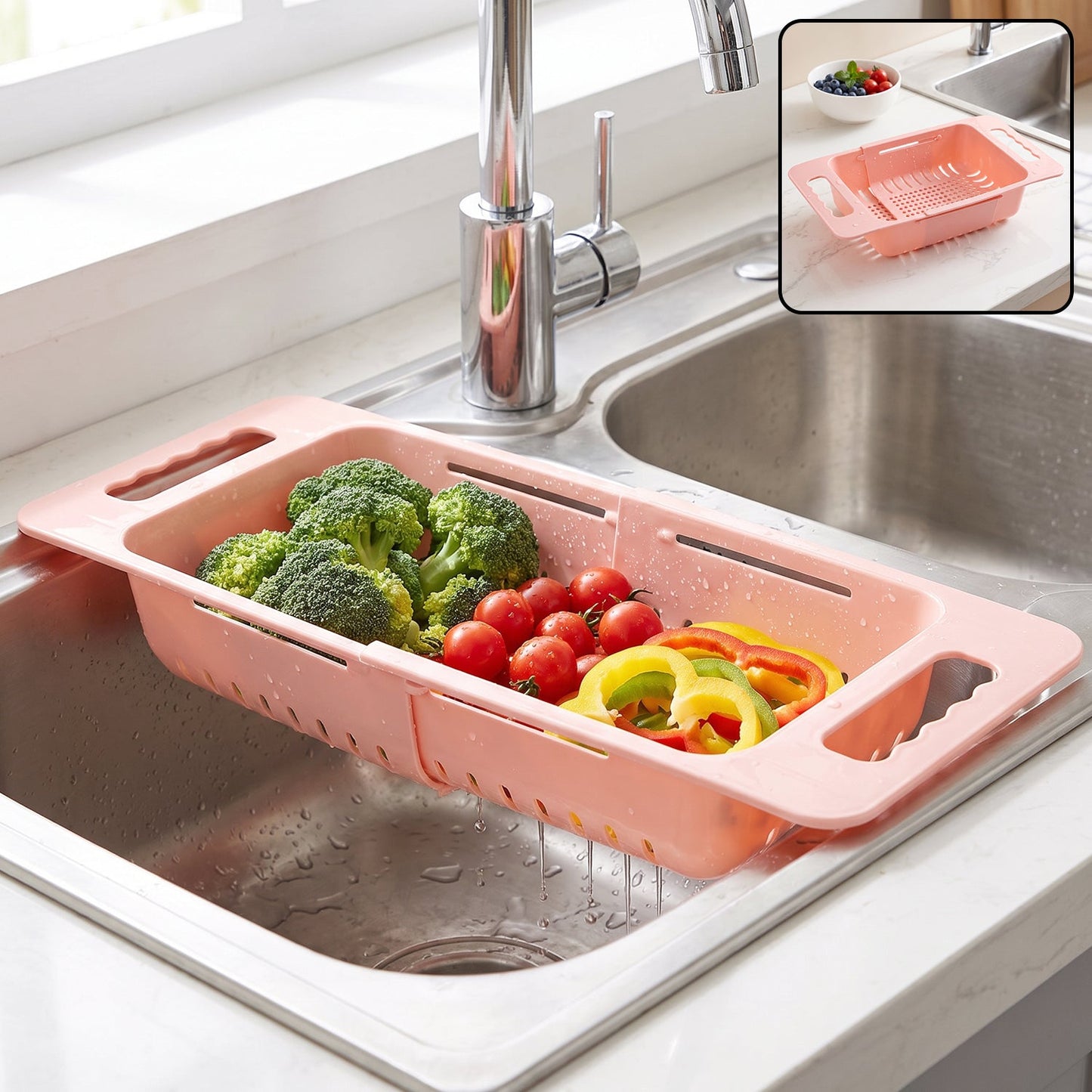 Pink plastic adjustable over-sink drain basket with broccoli, tomatoes, and bell peppers in a kitchen sink, with an inset