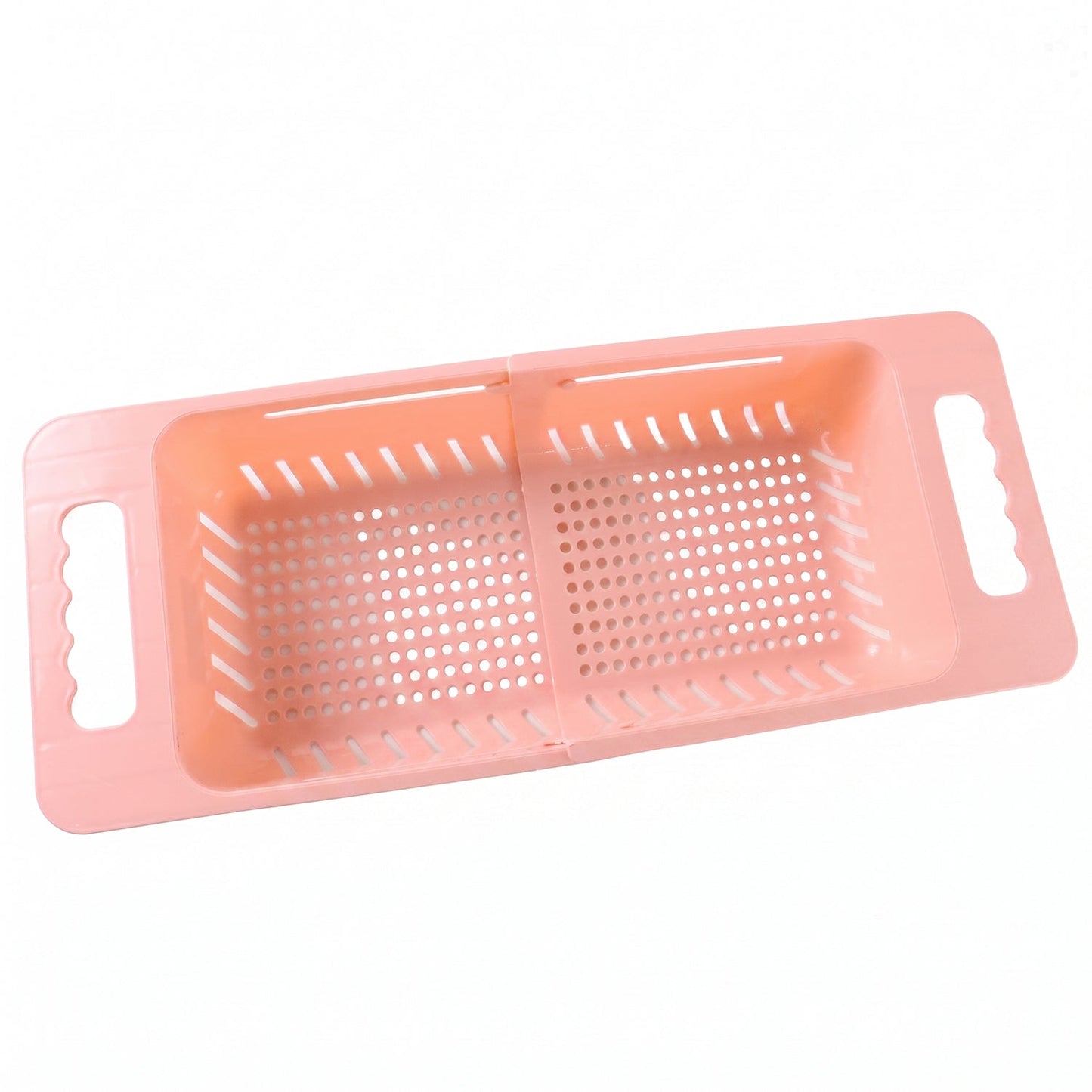 Pink plastic adjustable over-sink drain basket with perforated bottom and handles, extended to its full length.