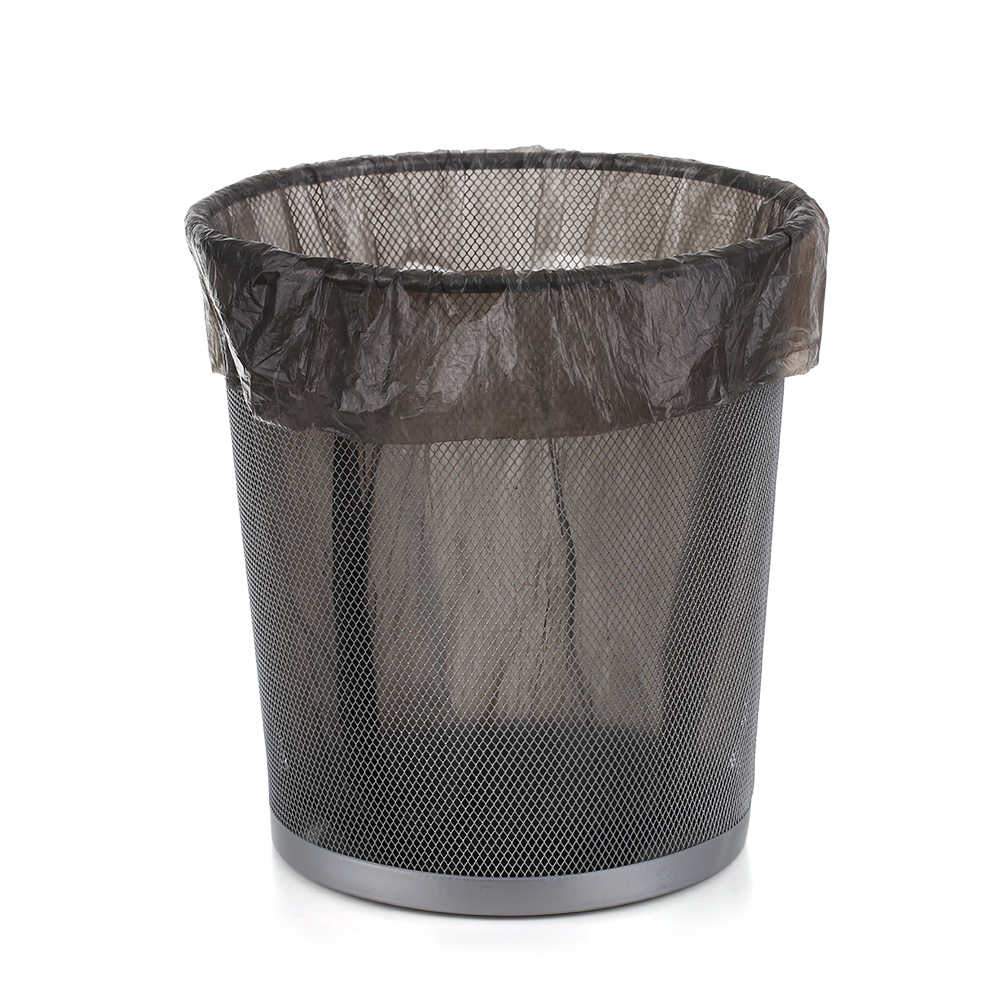 A black mesh trash can with a black plastic garbage bag liner inside.