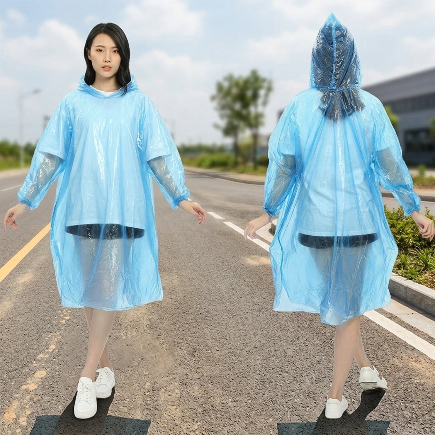 A woman in a blue plastic poncho smiles while walking in the rain on a city street with blurred vehicles.