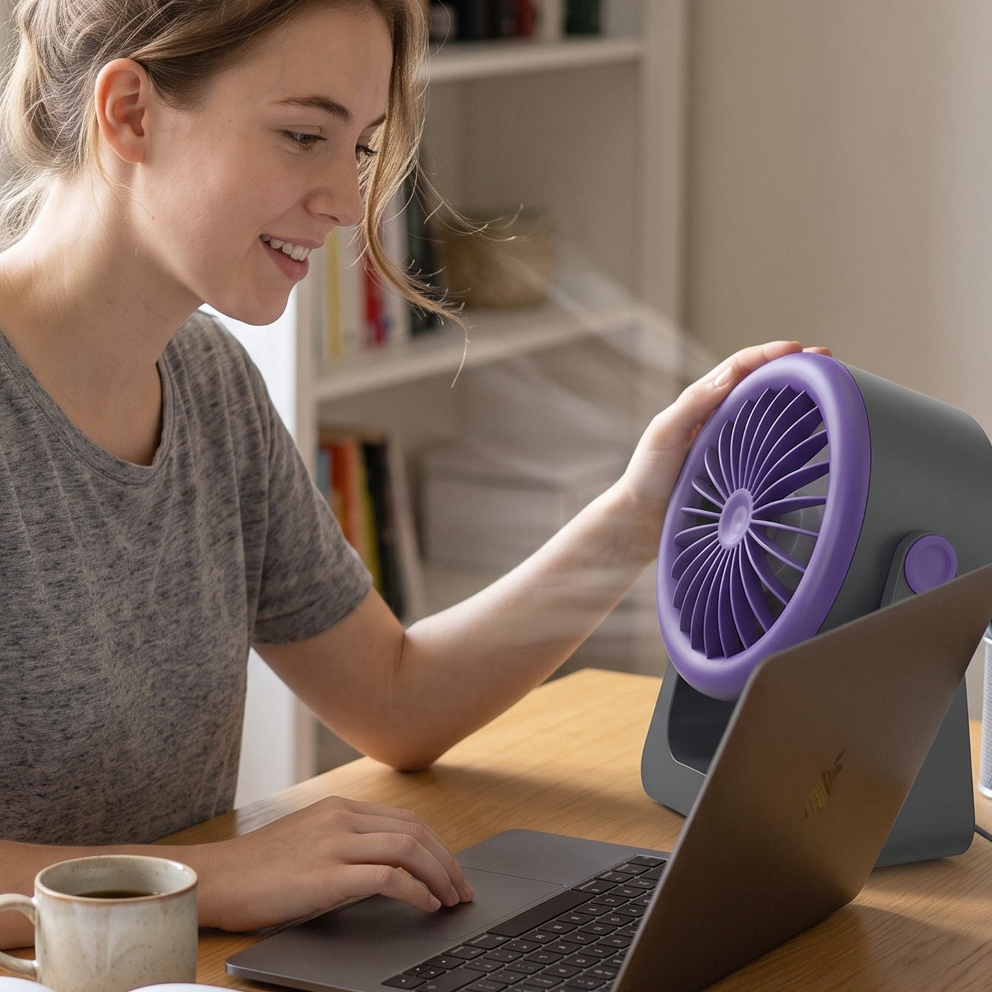 A gray and purple Personal Desktop Air Circulation Fan is shown head-on with a white USB-C cable below it.