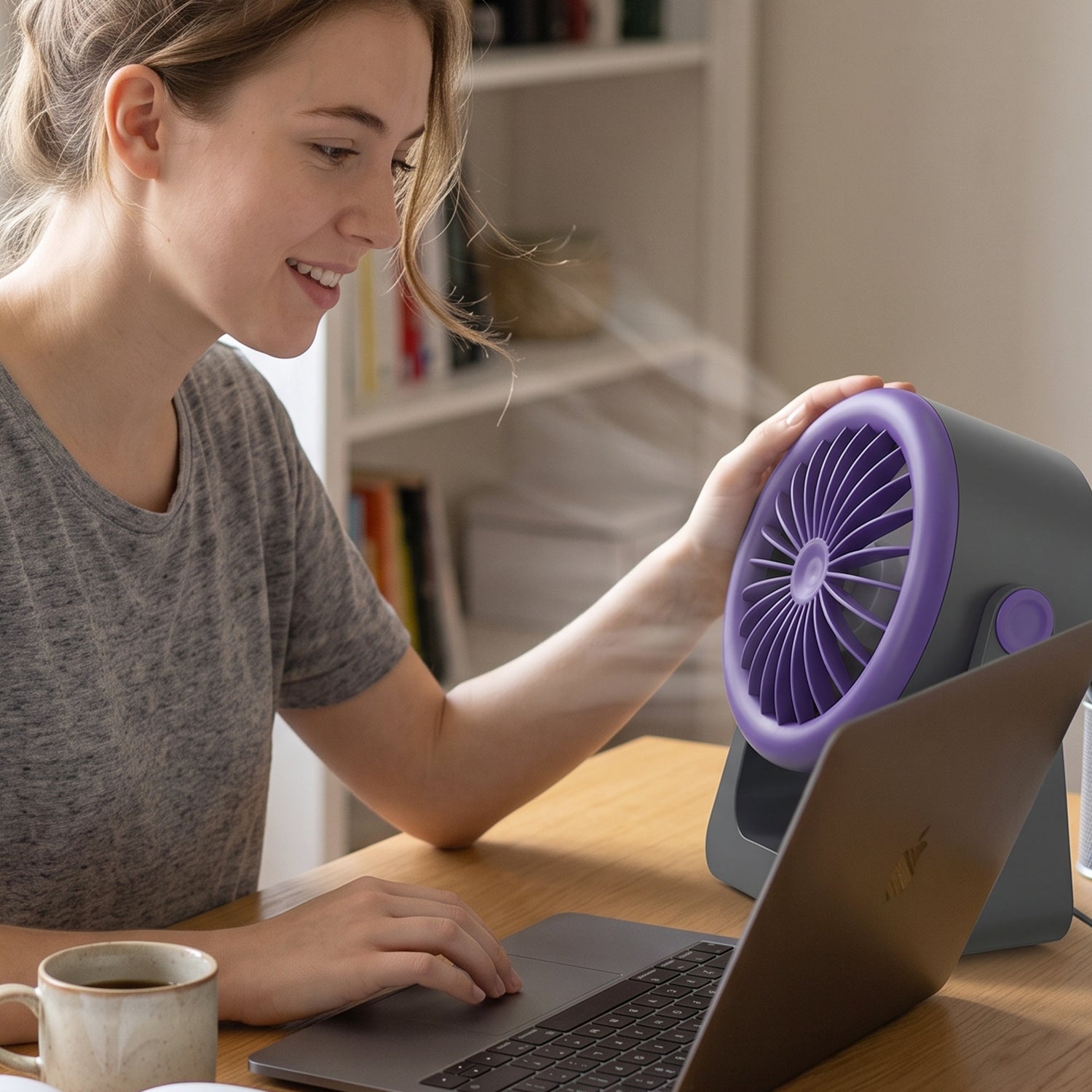 A gray and purple Personal Desktop Air Circulation Fan is shown head-on with a white USB-C cable below it.