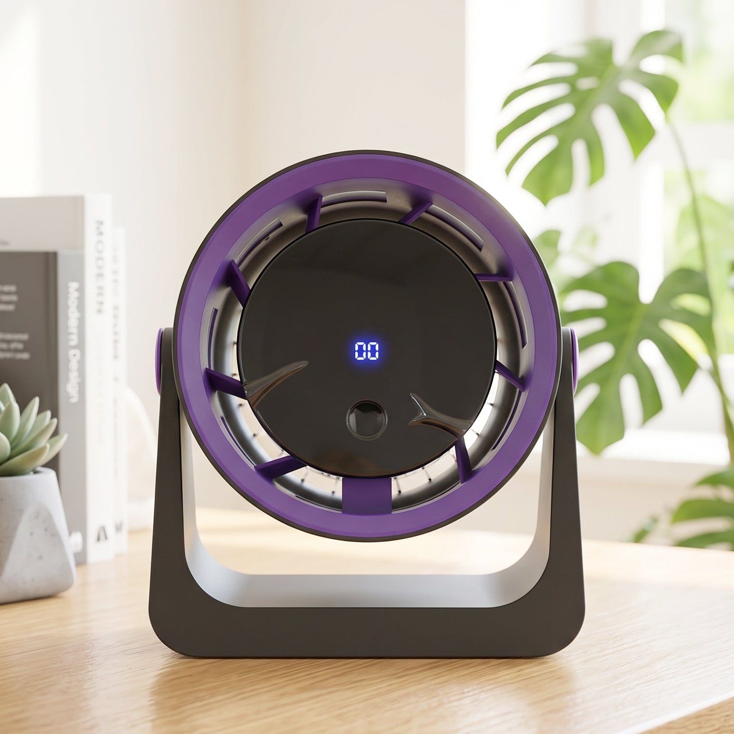 A woman uses a gray and purple Personal Desktop Air Circulation Fan next to her laptop on a wooden desk (1 Pc).