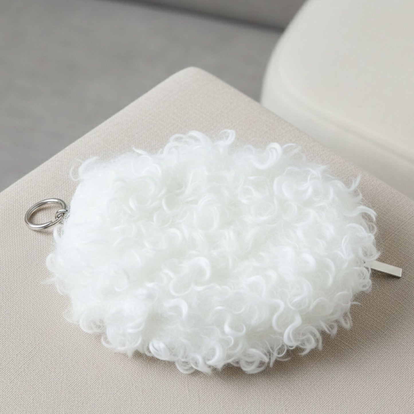 Close detail of soft fuzzy purse material and zipper