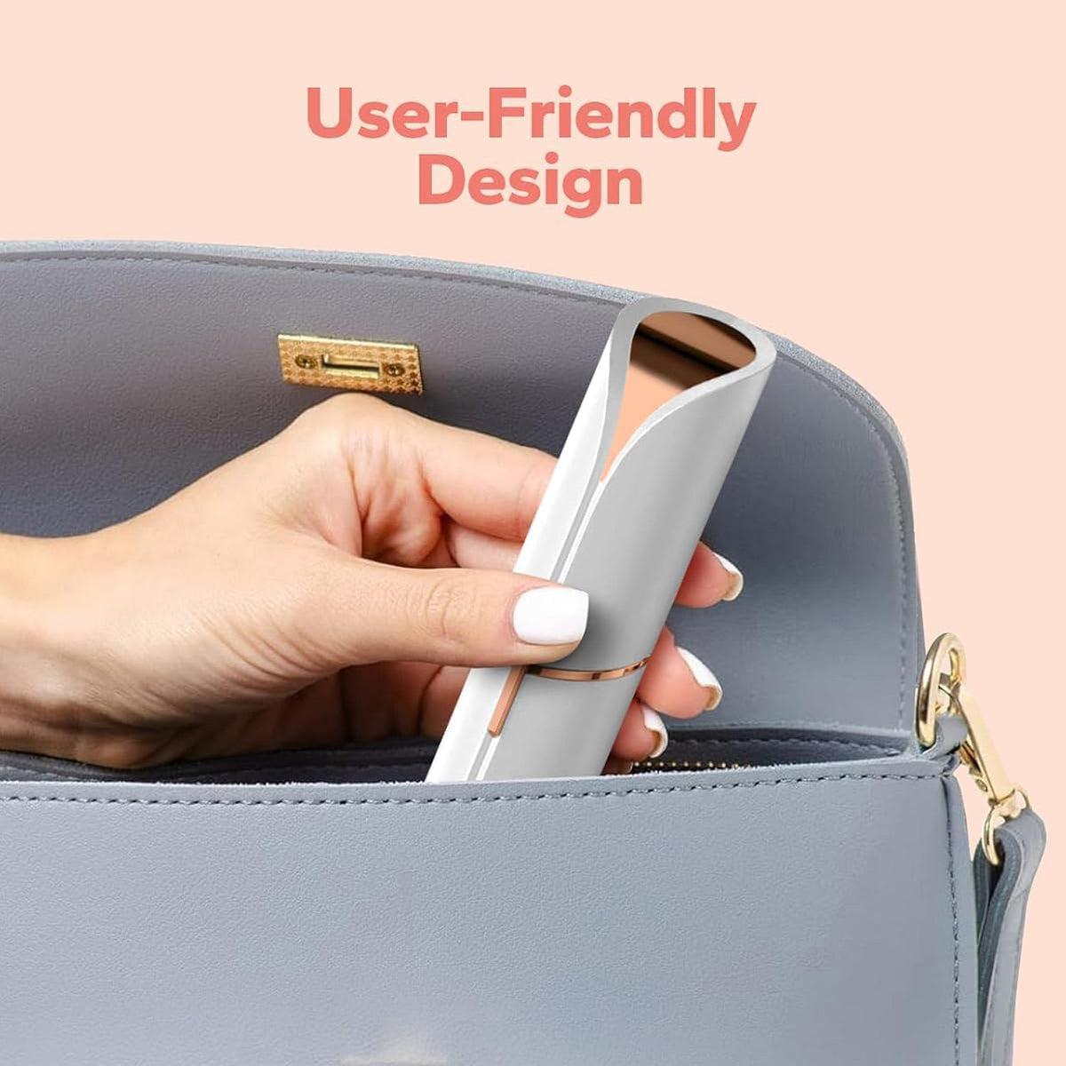 A hand placing the white and rose gold facial hair remover into a light grey handbag.