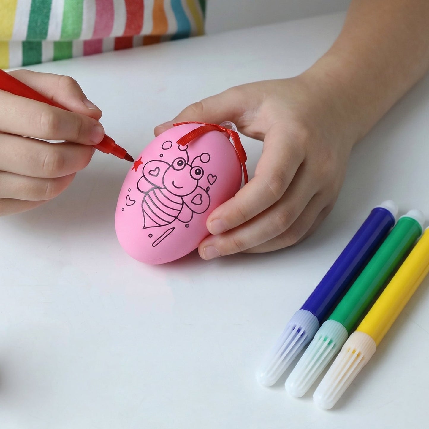 Egg coloring kit including color pens for kids’ creative crafts