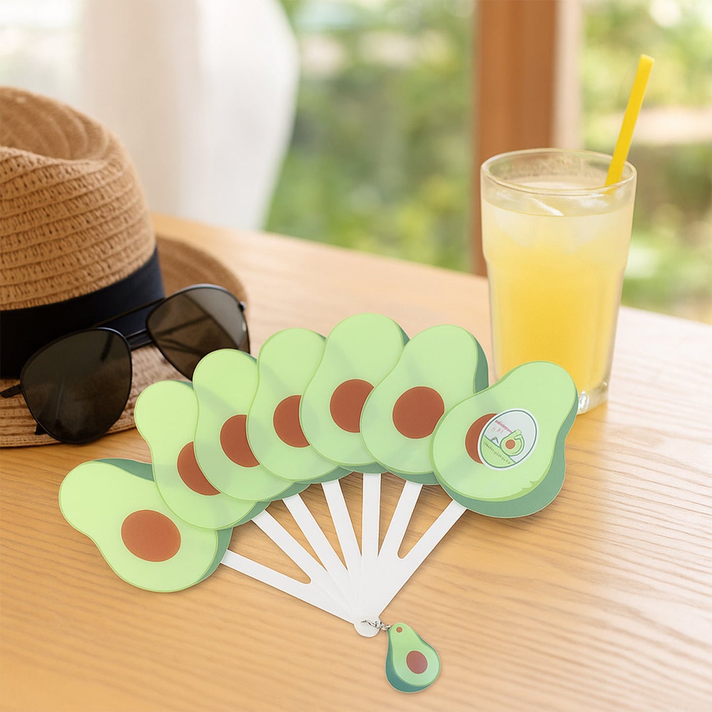 Foldable pocket fan closed inside protective case with keychain attached