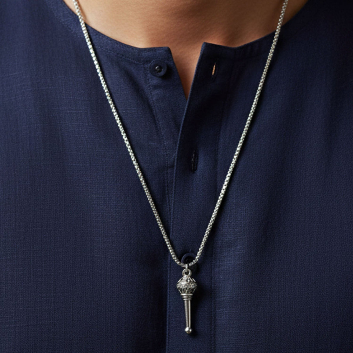 A detailed view of the Hanuman Gada Pendant with its accompanying chain.